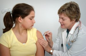 doctor vaccinating girl